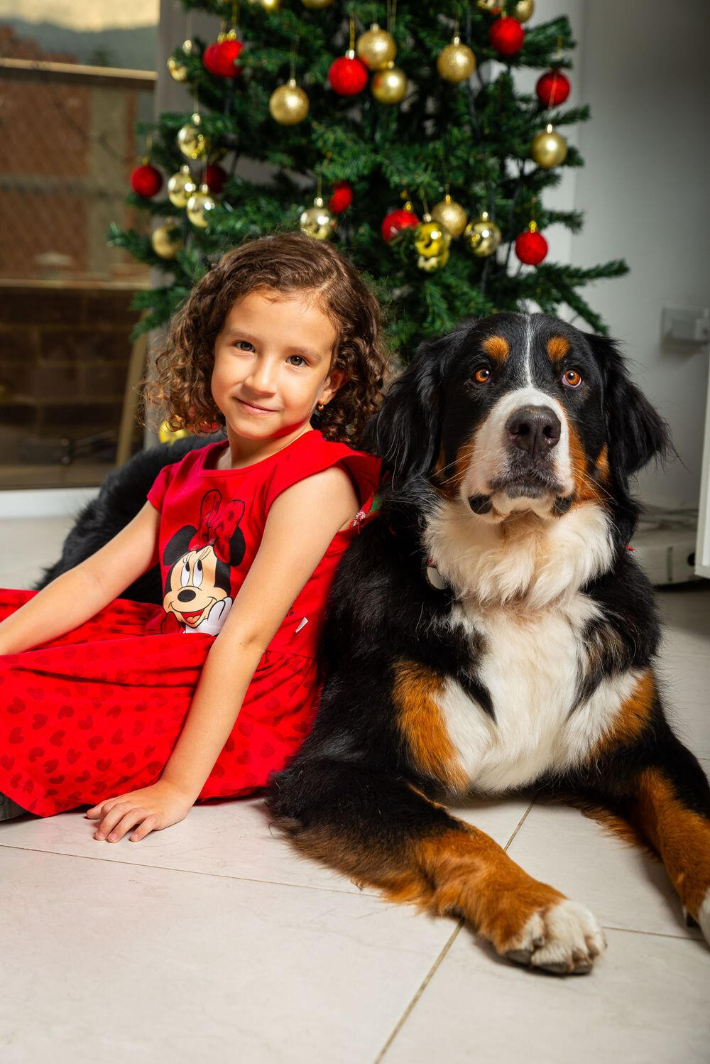 Juli seated beside Freya in front of a Christmas tree in December 2023
